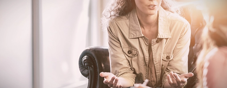 Individual discussing their online therapy options with their online therapist.